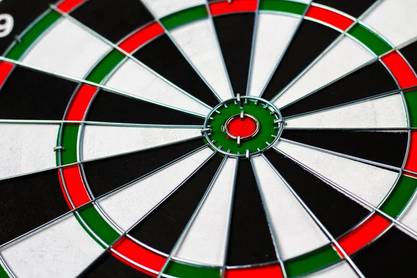 Target Darts. Red center, a dozen. Metaphor of success and achievement plans, background