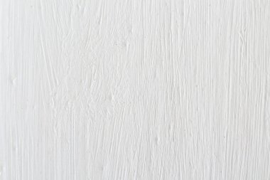 Duvardaki fırçadan lekeli beyaz boya dokusu, arka plan.