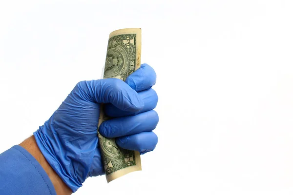 Uma Mão Numa Luva Médica Tem Dólar Num Fundo Branco — Fotografia de Stock