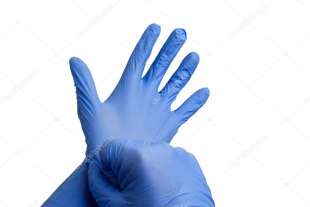 Hand pulls a medical glove on a white background, isolated.