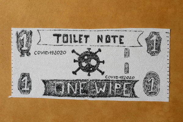 Money comic bill or note drawn on toilet paper. Panic shopping concept. Light brown background