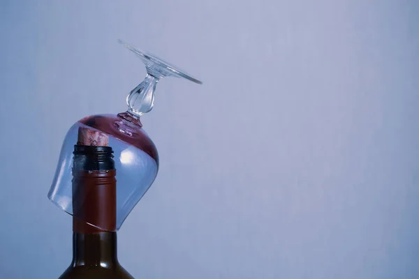 Glass on the neck of a bottle with copyspace for text, toned background