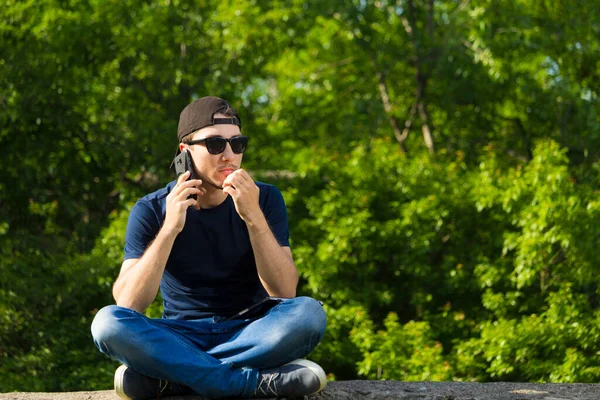 Young man with fear listens to the tirade on the phone