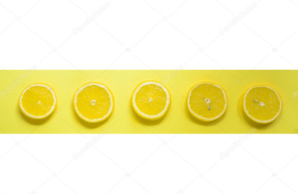 Minimal food concept. Lemon on a bright yellow background. Free space for text. Top view. Minimalism. Creative citrus.