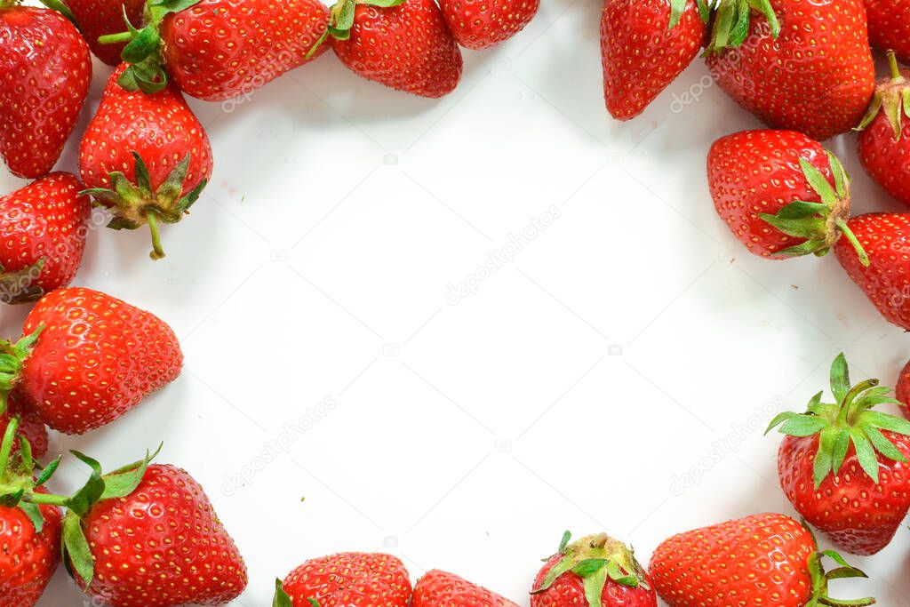 Minimal food concept. Strawberries on a white background. Top view. Free space for text. Tasty berries.