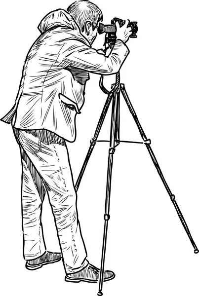 Un fotógrafo profesional disparando — Vector de stock