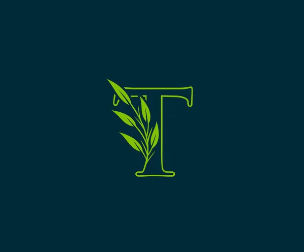 緑の葉のロゴを持つ最初のT字 — ストックベクタ