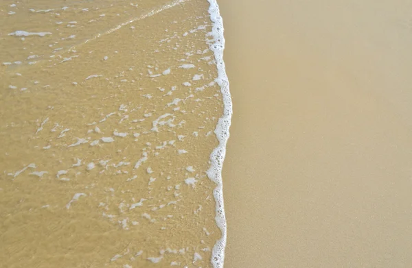 Wellen und Sand Hintergrund — Stockfoto