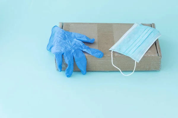 Blue Latex Glove Medical Mask Lie Cardboard Box Parcel Light — Stock Photo, Image