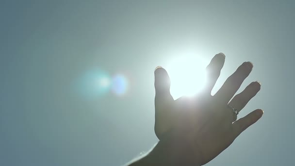 Slow Motion Abstract Sun Rays Through Female Fingers Palm — Stock Video