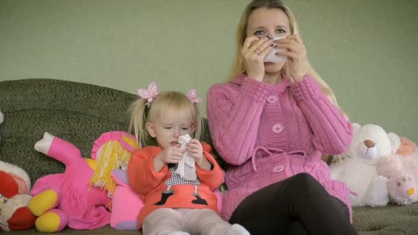 Mother with Little Girl Blowing Nose at Home — Stock Video