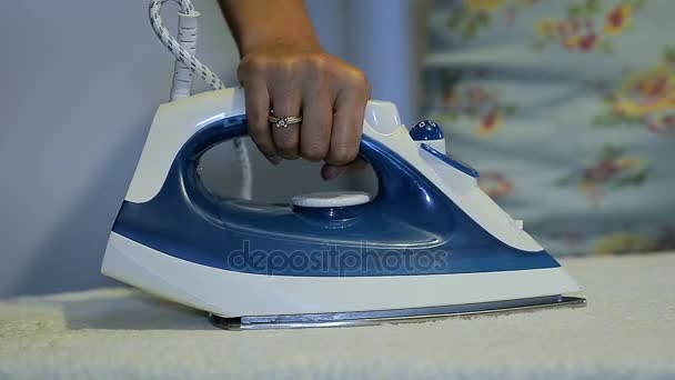 Close-Up of a Young Woman Ironing Clothes at Home — Stock Video