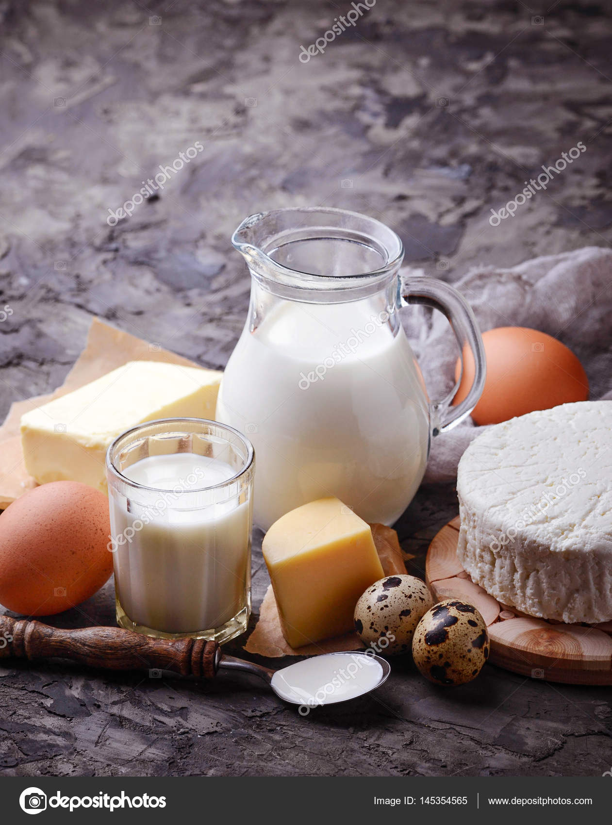 Milk, cottage cheese, sour cream, butter, eggs — Stock Photo © yulianny