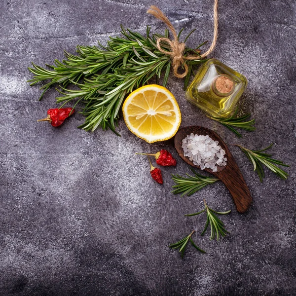 Rosemary, salt, lemon, oil and pepper — Stock Photo, Image