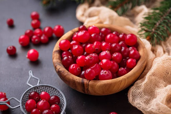 Fresh ripe cranberry in wooden bowl — Stock Photo, Image