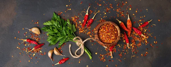 Red chili peppers, garlic and parsley — Stock Photo, Image