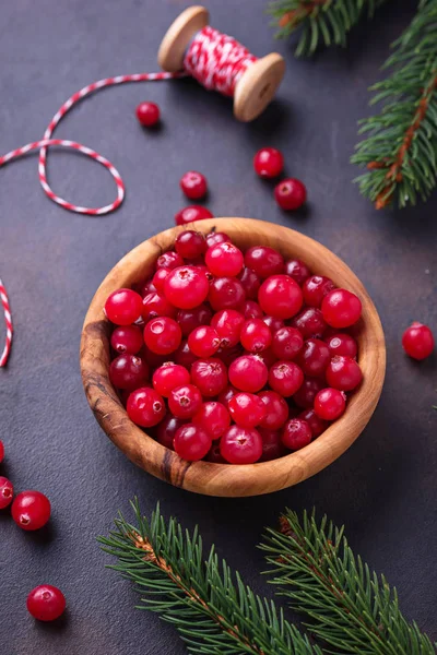 Fresh ripe cranberry in wooden bowl — Stock Photo, Image