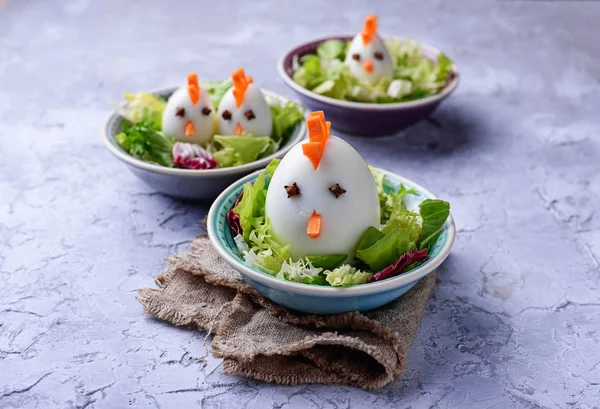 Salad with eggs in shape of chickens. Festive food. — Stock Photo, Image