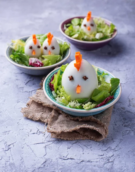 Salad with eggs in shape of chickens. Festive food. — Stock Photo, Image