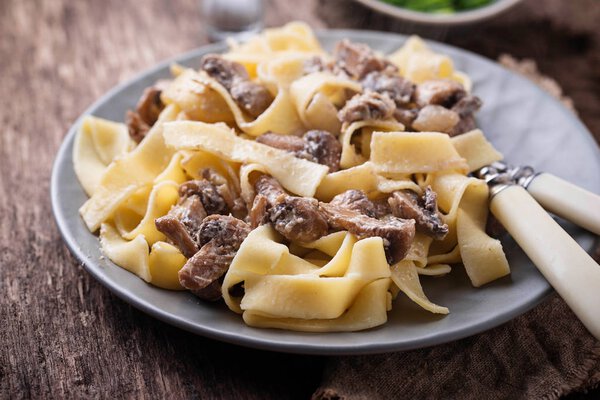 Pasta tagliatelle  with  mushrooms