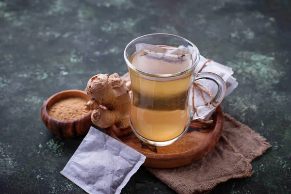 Ginger root and tea bags. — Stock Photo, Image