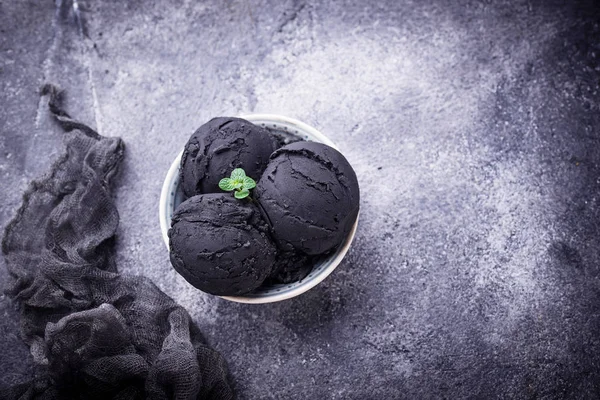 Black ice cream. Trendy food