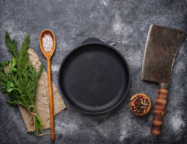 Culinary background with spices, pan and cleaver — Stock Photo, Image