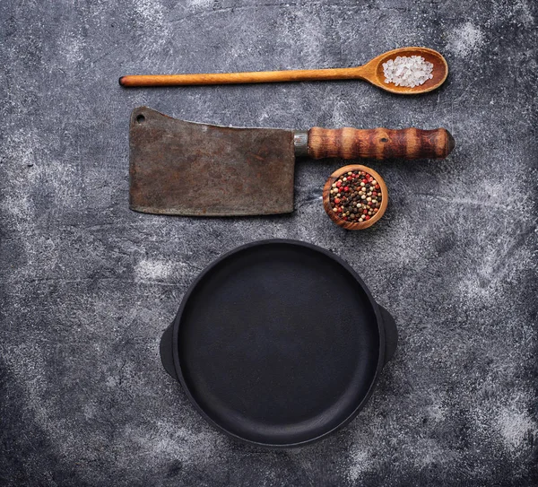Culinary background with spices, pan and cleaver — Stock Photo, Image