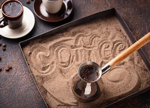 Traditional turkish coffee prepared on hot sand — Stock Photo, Image