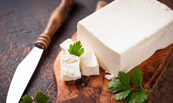 Feta cheese on rusty background — Stock Photo, Image