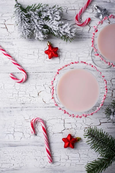 Pink peppermint martini with candy cane rim — Stock Photo, Image