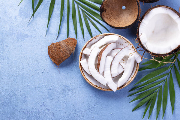 Sliced coconut and palm leaves