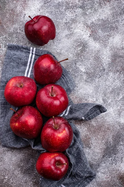 Fresh red ripe apples on gray background — Stock Photo, Image