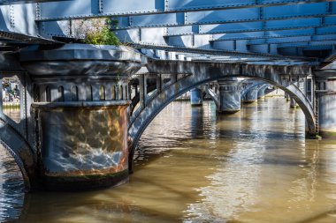 Yarra river flowing under Queens Bridge in Melbourne CBD, Australia clipart