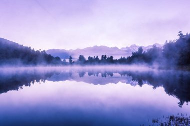 Beautiful reflections of Southern Alps at Lake Matheson on early morning, South Island, New Zealand clipart