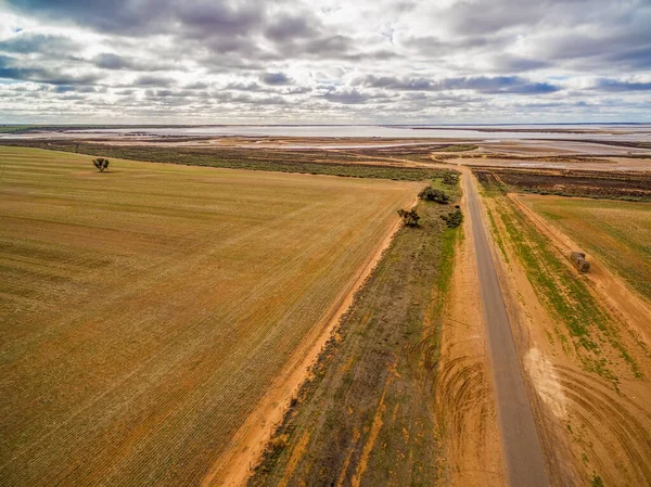 Gravel road leading to Lake Tyrrell in Victoria, Australia - aerial view