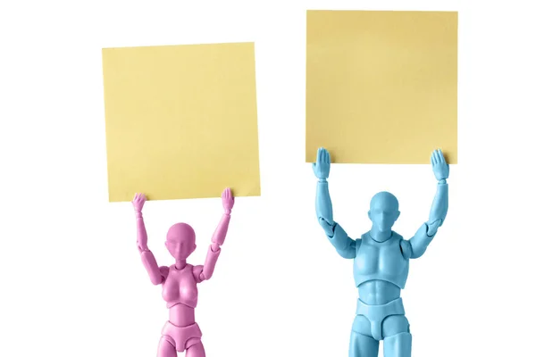 Male Female Figurines Closeup Holding Yellow Square Pieces Paper Heads — Stock Photo, Image