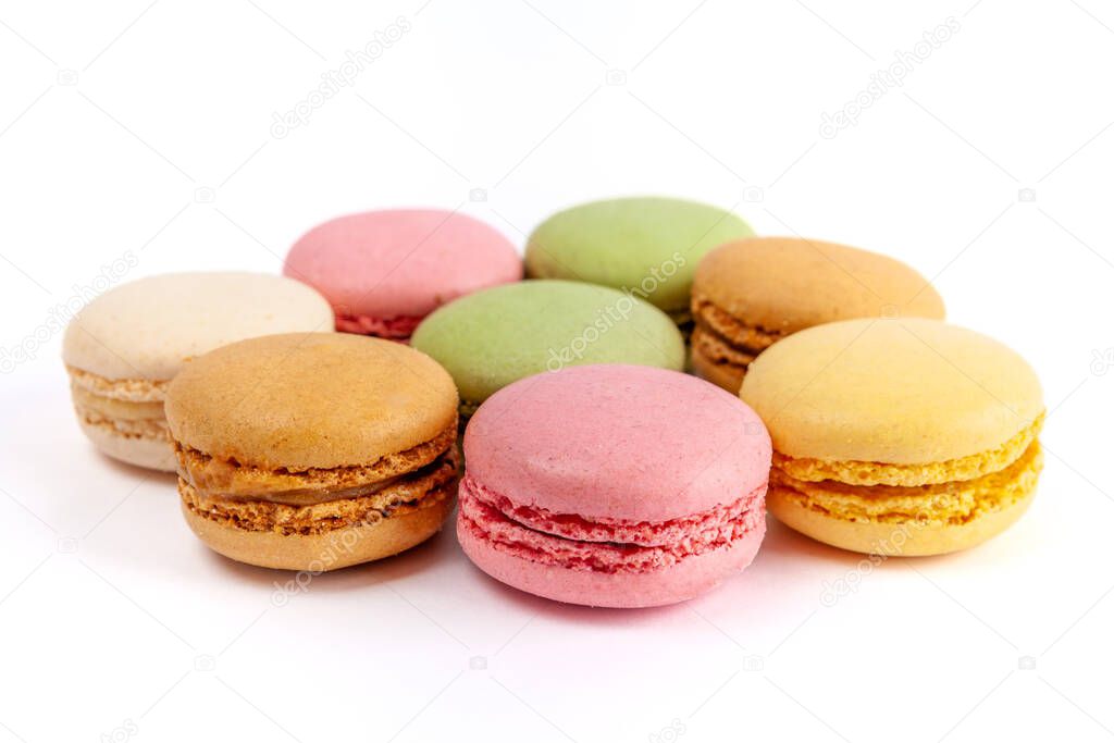 Yummy colorful macarons isolated on white background