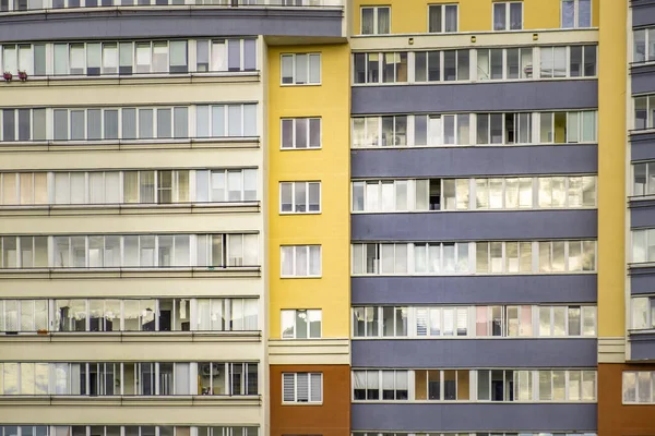 Rows of windows in residential high rise building closeup in Eastern Europe