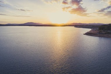 Sunset over Hume Dam and Lake Hume with copy space - aerial landscape clipart