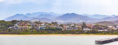 Panorama of luxury houses and mountains at Coffs Harbour, New South Wales, Australia clipart
