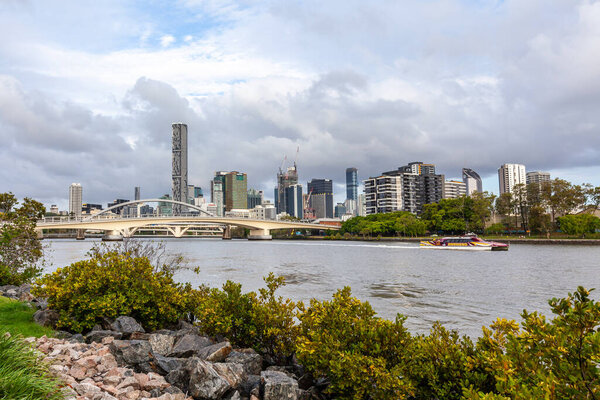 BRISBANE, Australia - January 9 2019: CityCat ferry sailing the Brisbane river among the high-rise buildings