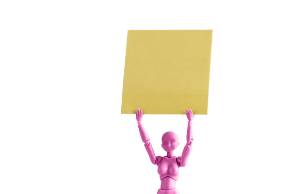 Pink Female Figurine Holding Yellow Note High Her Head Isolated — Stock Photo, Image