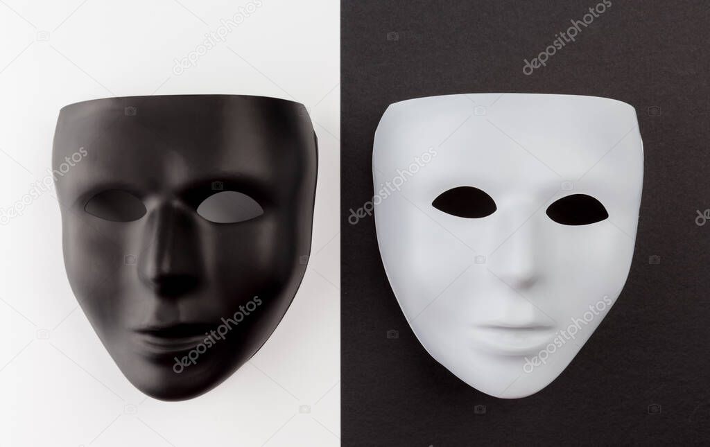 Black mask on white and white mask on black. Identity change concept.