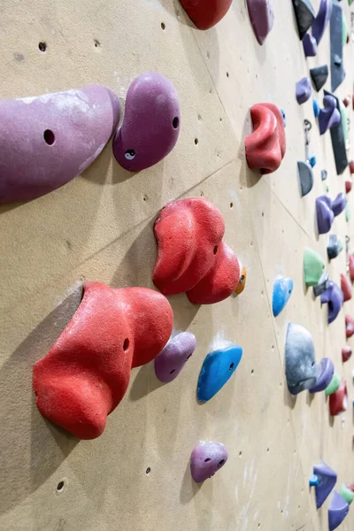 Holds on climbing gym wall closeup