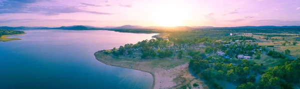 Beautiful lake and countryside at sunset - aerial panorama