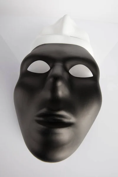 Black White Masks Joined White Reflective Background Wide Angle Vertical — Stock Photo, Image