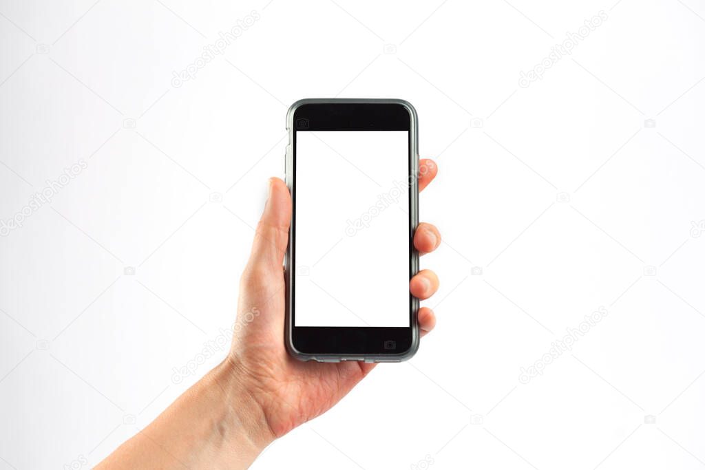 Female hand holding a mobile phone in vertical orientation. Isolated on white background with white screen.