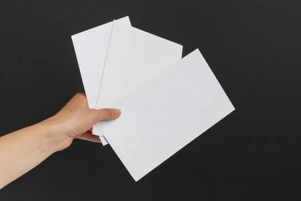 Female Hand Delivering Three Postage Envelopes Black Background — Stock Photo, Image