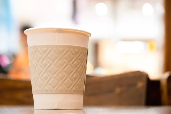 White disposable coffee cup with copy space - shallow focus